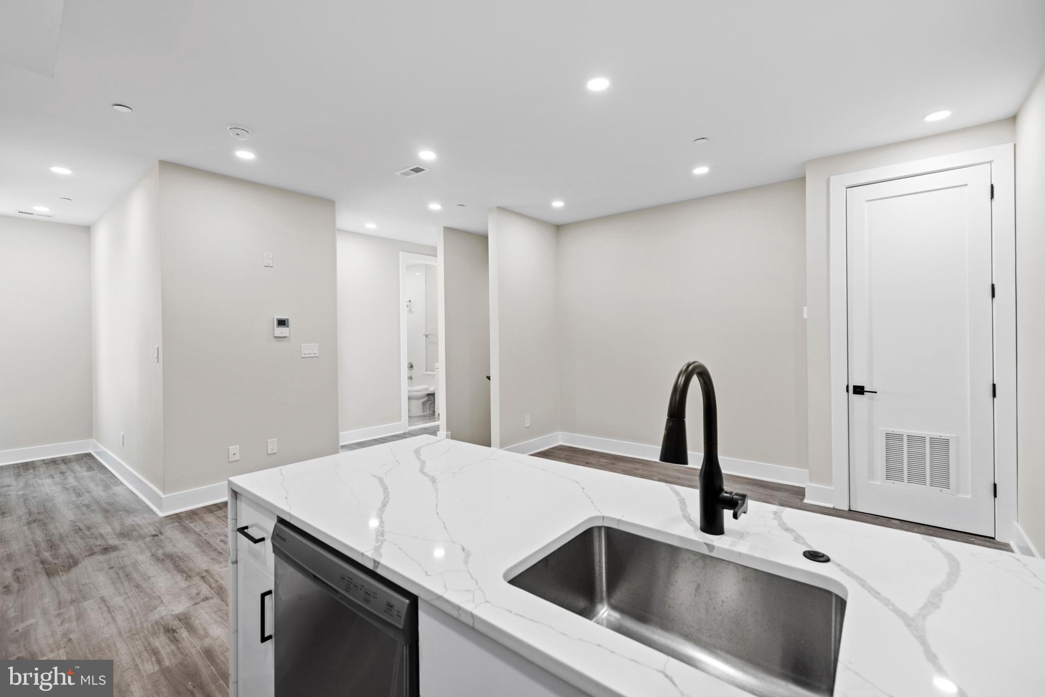 824 18th Street Northeast, Unit 12 Washington, DC 20002 - Photo 15 of 25 a kitchen with a sink and a refrigerator