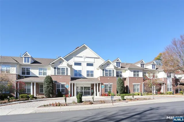 a front view of a building with a street view