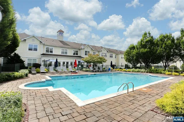 a view of a patio with a table and chairs