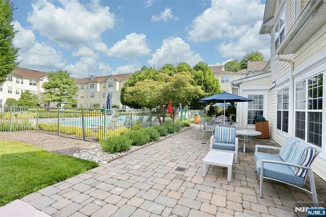 a front view of a residential houses with yard