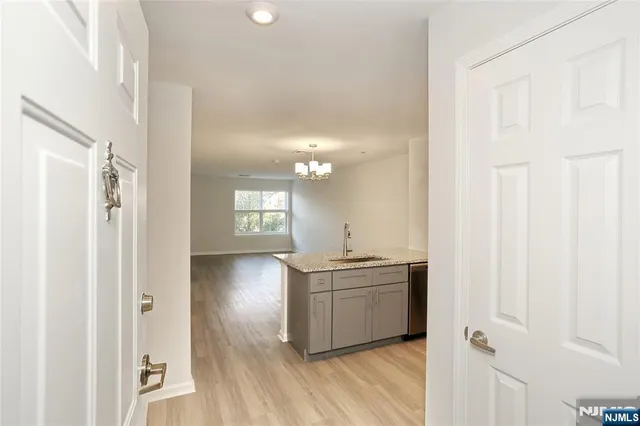 a view of a kitchen cabinets and wooden floor