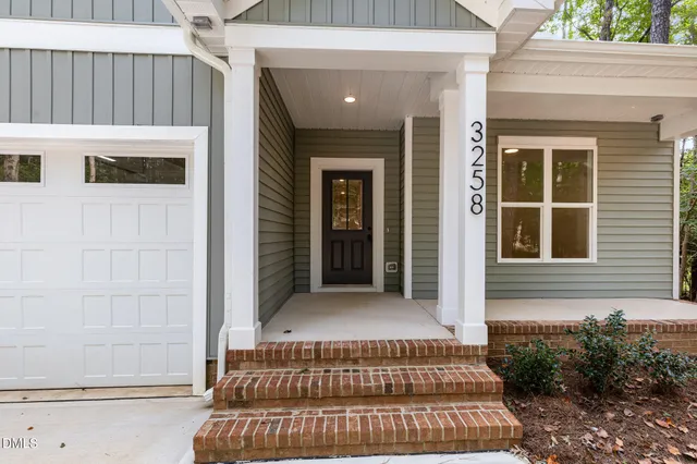 a front view of a house with a porch