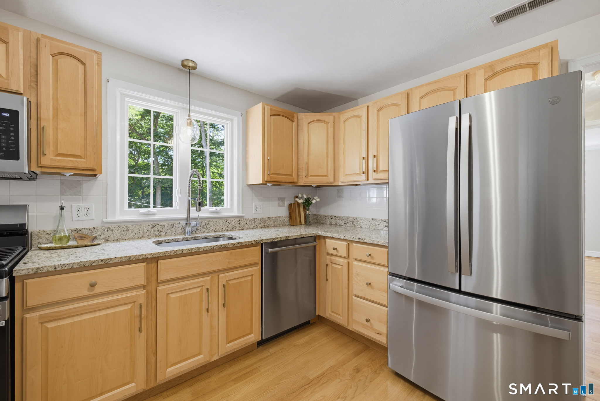 224 Spring Street Manchester, CT 06040 - Photo 9 of 39 a kitchen with stainless steel appliances granite countertop a refrigerator sink and cabinets