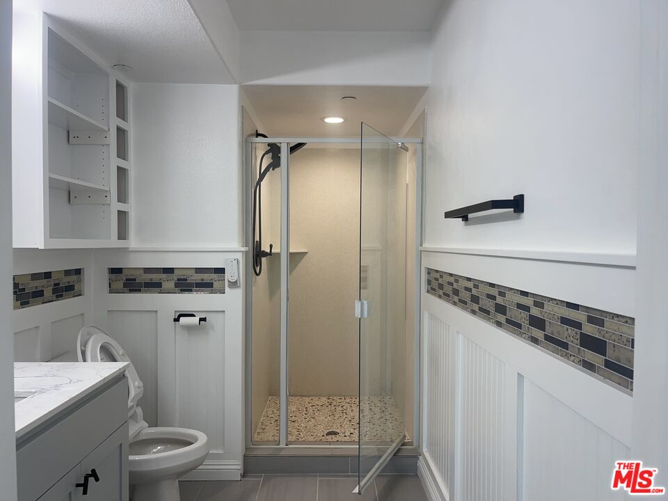 1401 Lomita Boulevard, Unit 205 Harbor City, CA 90710 - Photo 17 of 19 a bathroom with a shower toilet and sink