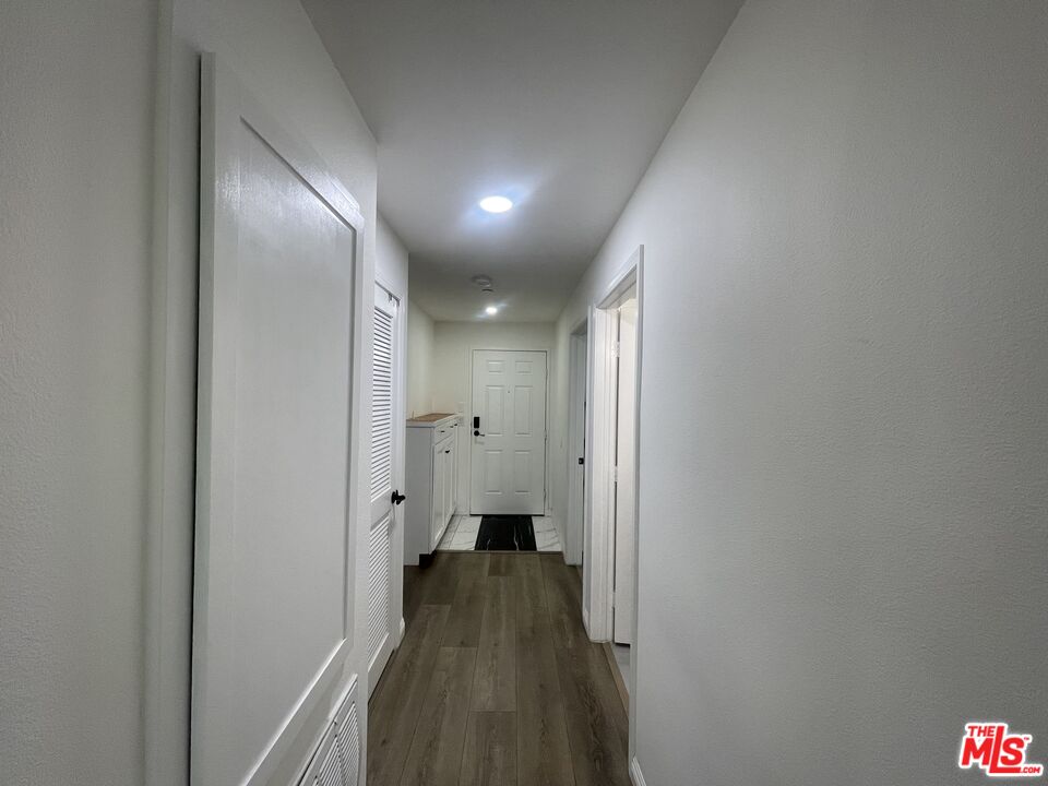 1401 Lomita Boulevard, Unit 205 Harbor City, CA 90710 - Photo 19 of 19 a view of hallway with wooden floor