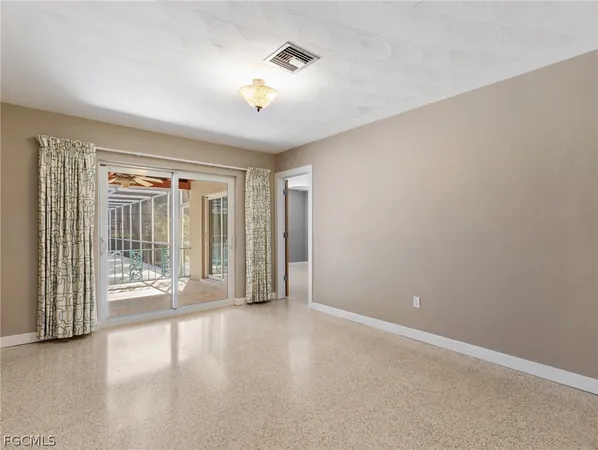 a view of n empty room with a window