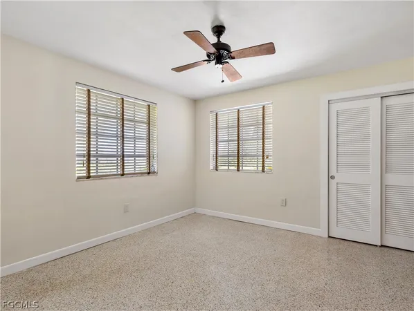 a view of room with window and cabinet