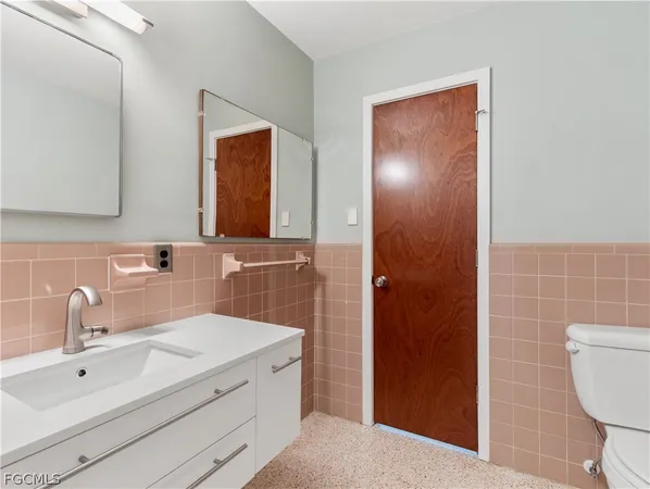 a view of a room with a ceiling fan