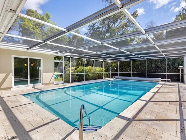 a view of swimming pool with seating area