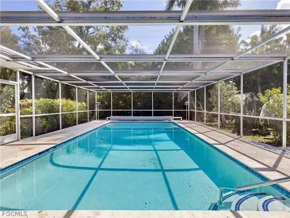 a view of swimming pool with seating area