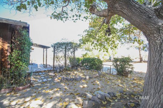 4664 West Ridgecrest Boulevard Ridgecrest, CA 93555 - Photo 4 of 33 a backyard of a house with lots of green space