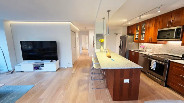 a view of a living room and bedroom