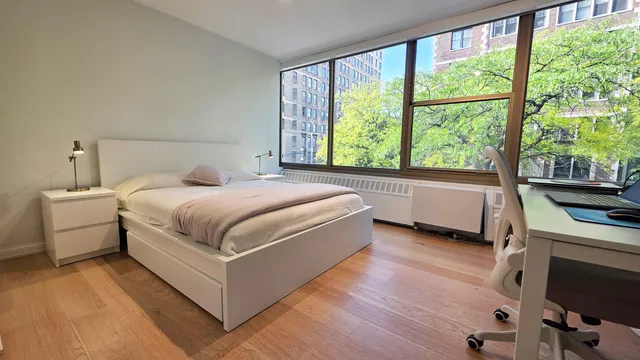 a bed room with a bed and a couch