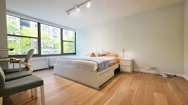 a bathroom with a shower and a sink