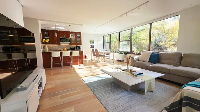 a living room with furniture and a large window