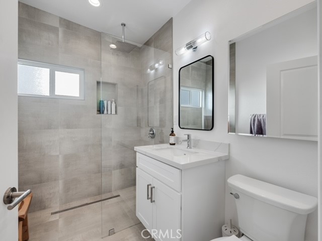 30280 Santa Rosa Road Lucerne Valley, CA 92356 - Photo 24 of 61 a bathroom with a toilet sink and mirror