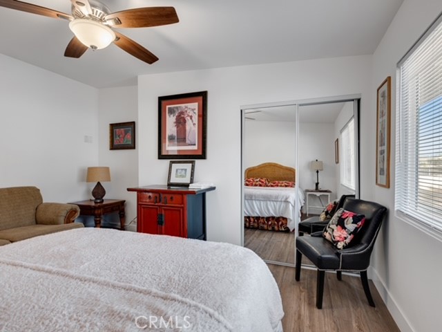 30280 Santa Rosa Road Lucerne Valley, CA 92356 - Photo 27 of 61 a bedroom with a bed and wooden floor