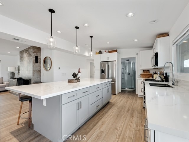 30280 Santa Rosa Road Lucerne Valley, CA 92356 - Photo 41 of 61 a large kitchen with kitchen island a sink counter space and stainless steel appliances