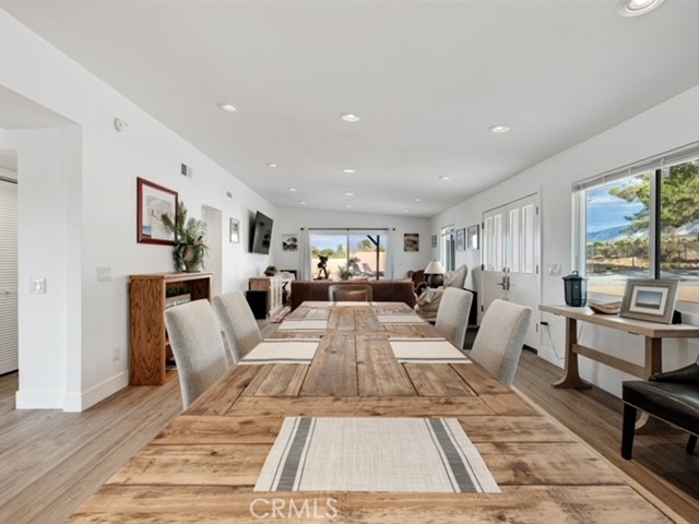 30280 Santa Rosa Road Lucerne Valley, CA 92356 - Photo 43 of 61 a living room with furniture fireplace and large windows