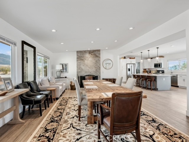 30280 Santa Rosa Road Lucerne Valley, CA 92356 - Photo 47 of 61 a large dining space with furniture window and wooden floor