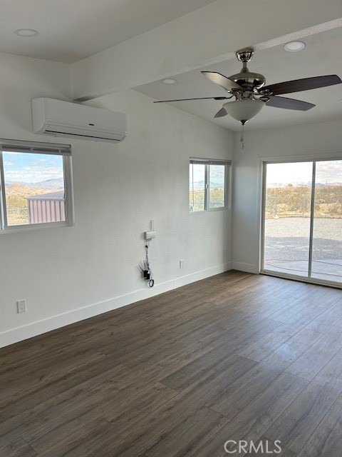 30280 Santa Rosa Road Lucerne Valley, CA 92356 - Photo 51 of 61 an empty room with wooden floor fan and windows