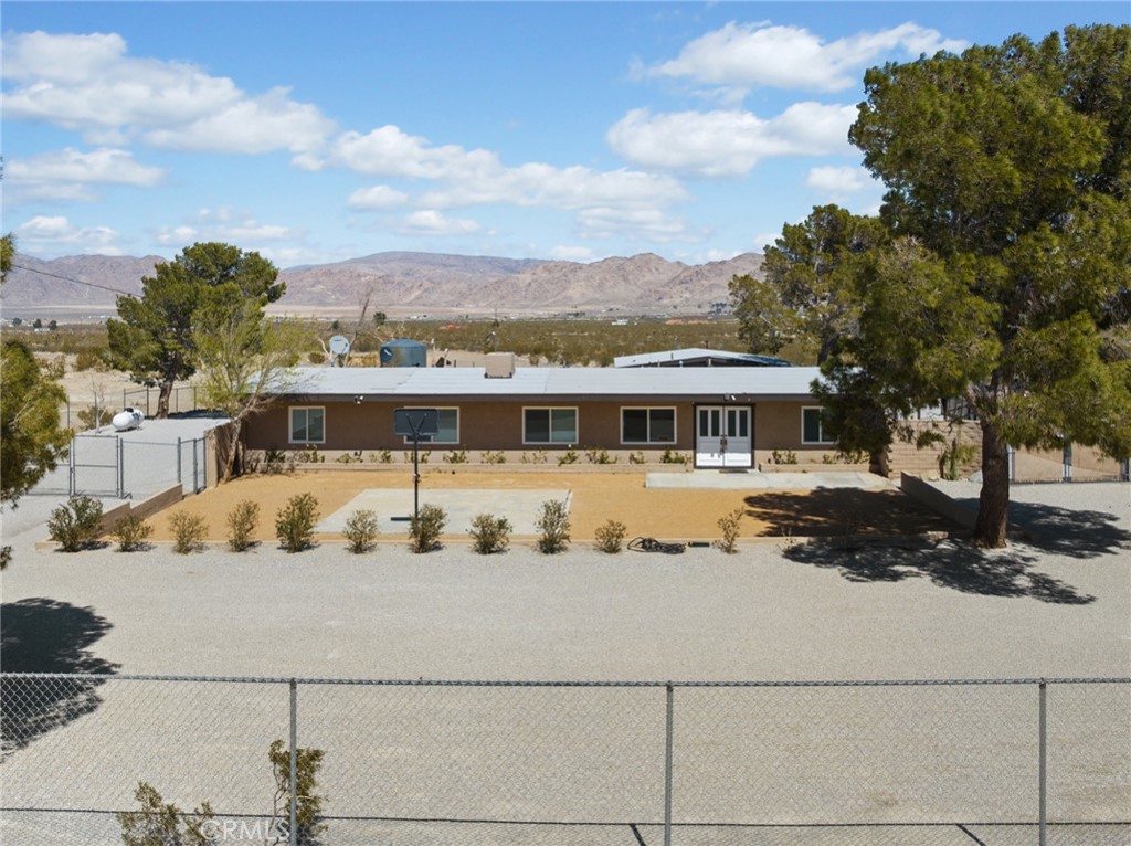 30280 Santa Rosa Road Lucerne Valley, CA 92356 - Photo 61 of 61 a front view of a house with a yard