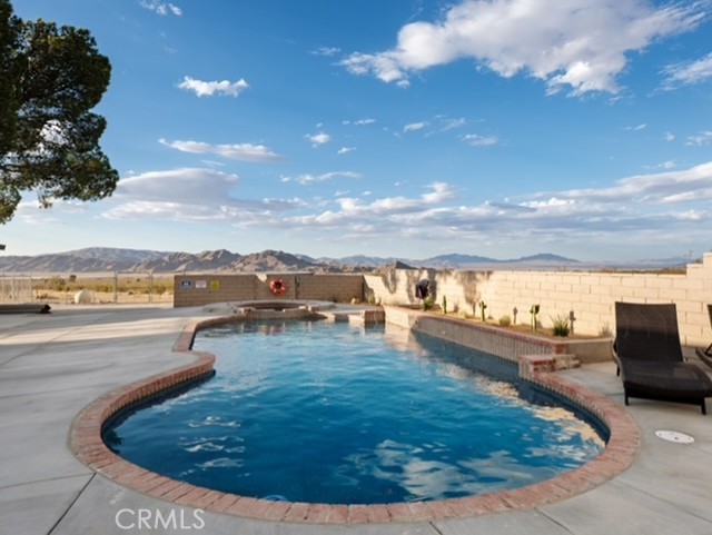 30280 Santa Rosa Road Lucerne Valley, CA 92356 - Photo 9 of 61 a view of a swimming pool and an outdoor seating