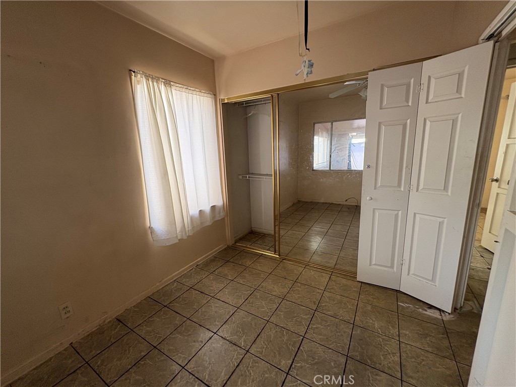 14023 Studebaker Road Norwalk, CA 90650 - Photo 16 of 33 a view of an empty room with a window