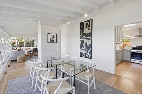a view of a dining room with furniture and a livingroom