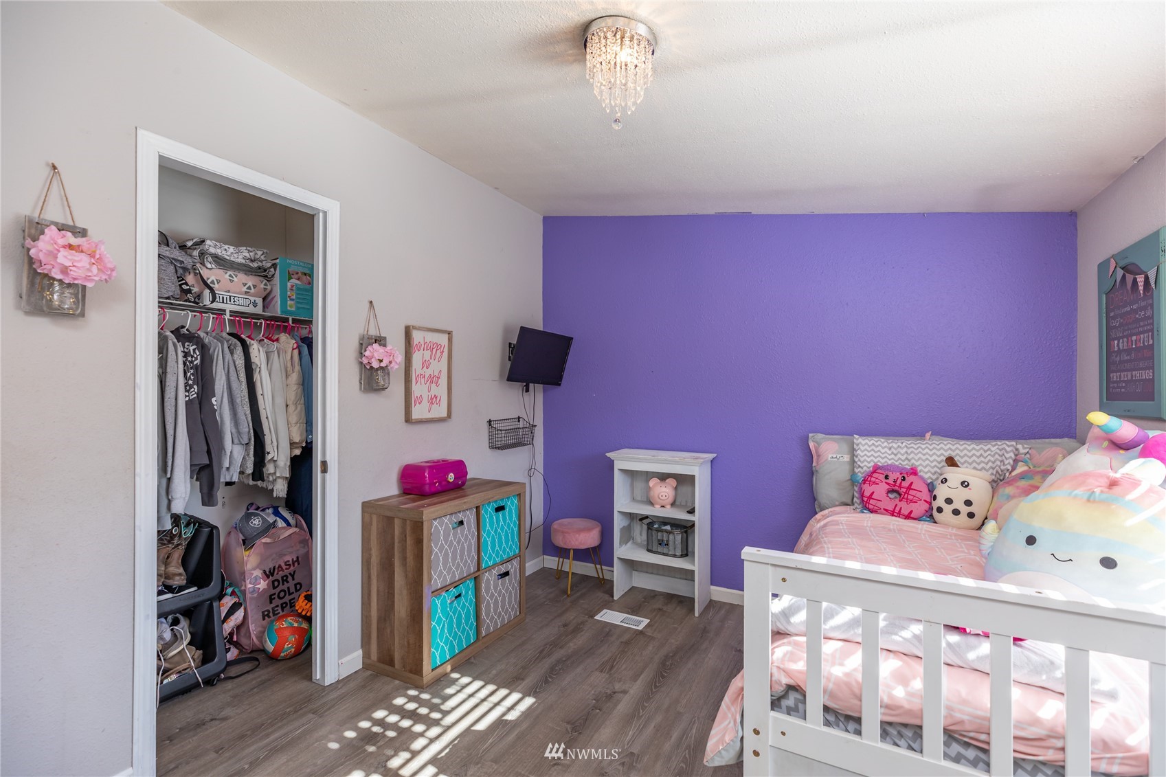 57 Alvarado Road Tonasket, WA 98855 - Photo 15 of 39 a bedroom with furniture and a wooden floor