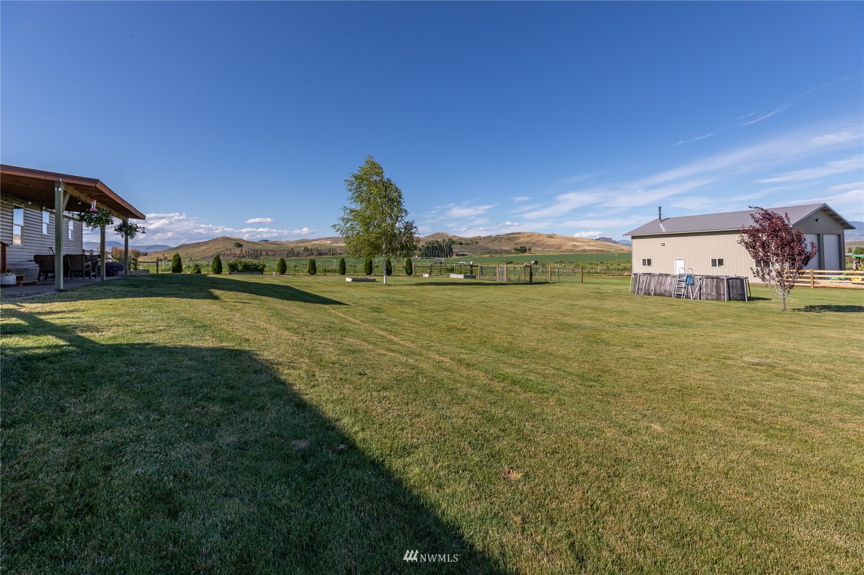 57 Alvarado Road Tonasket, WA 98855 - Photo 37 of 39 a view of a large building with a big yard