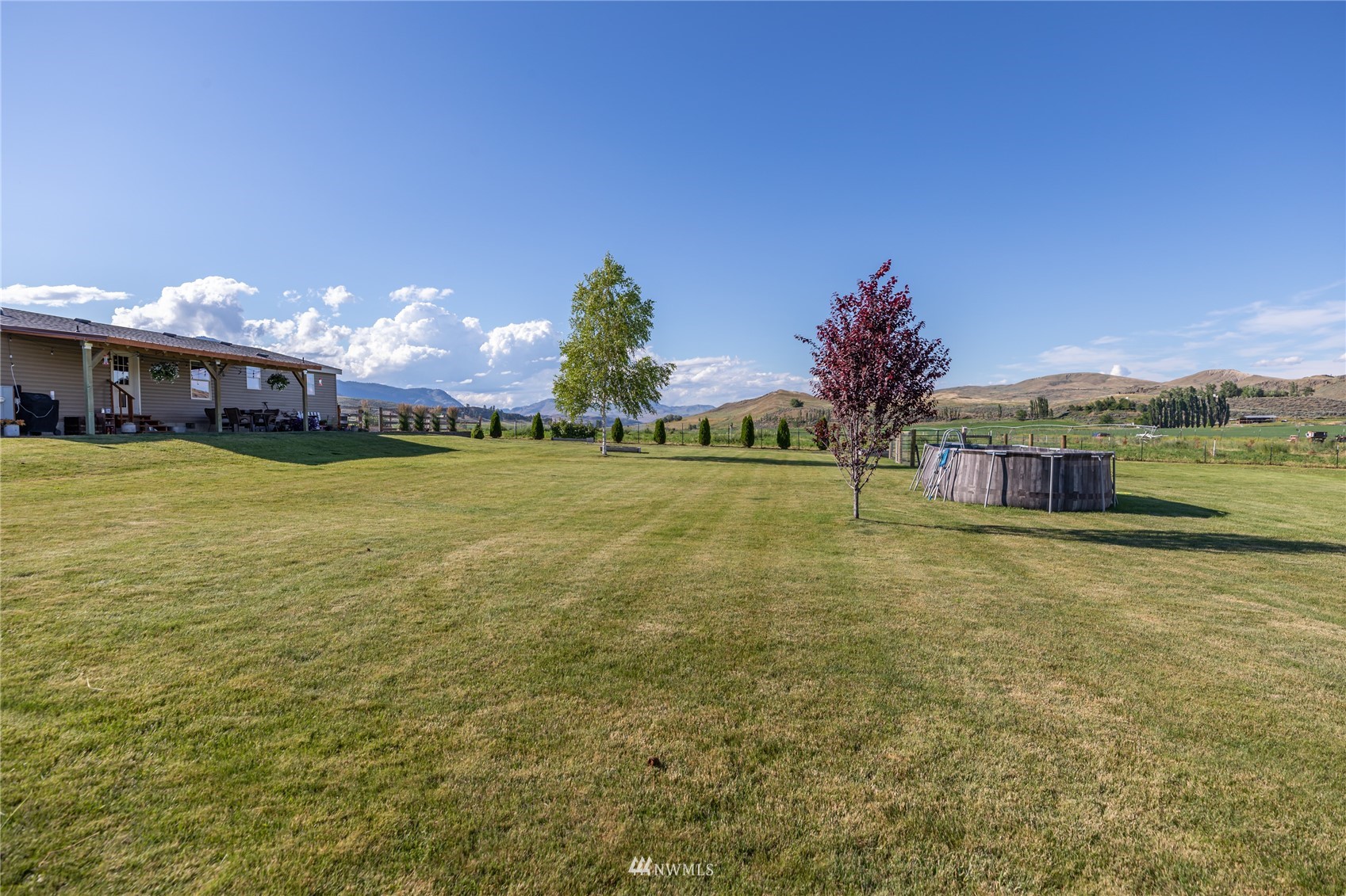 57 Alvarado Road Tonasket, WA 98855 - Photo 39 of 39 a view of a town with large trees