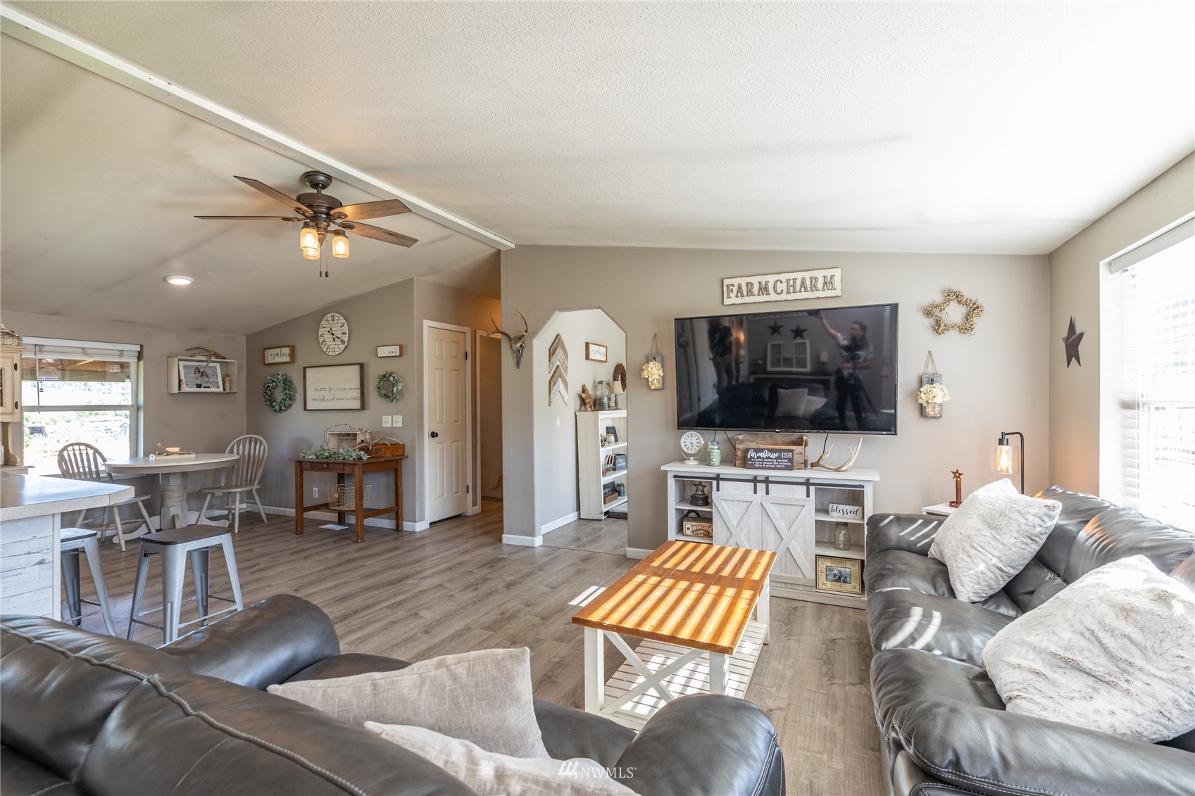 57 Alvarado Road Tonasket, WA 98855 - Photo 5 of 39 a living room with furniture and a flat screen tv