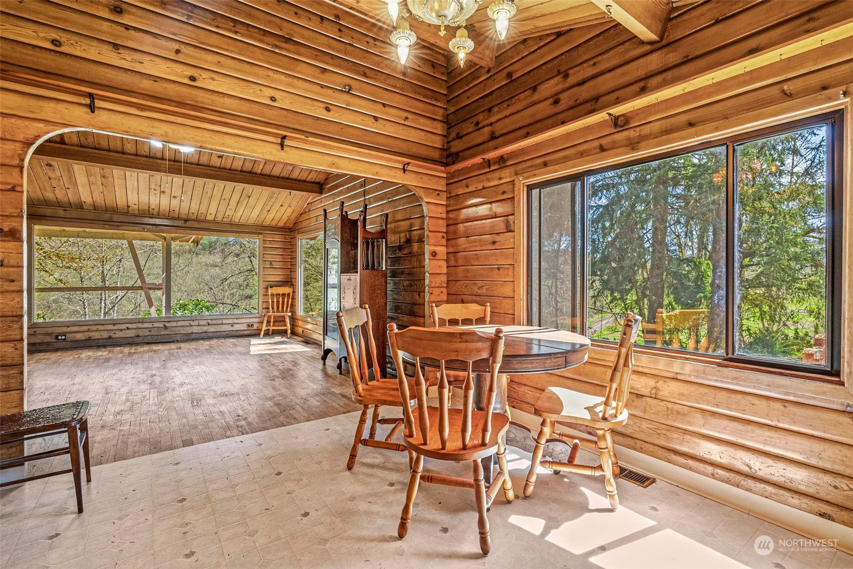 273 Middle Valley Road Skamokawa, WA 98647 - Photo 16 of 30 a dining room with furniture and large windows
