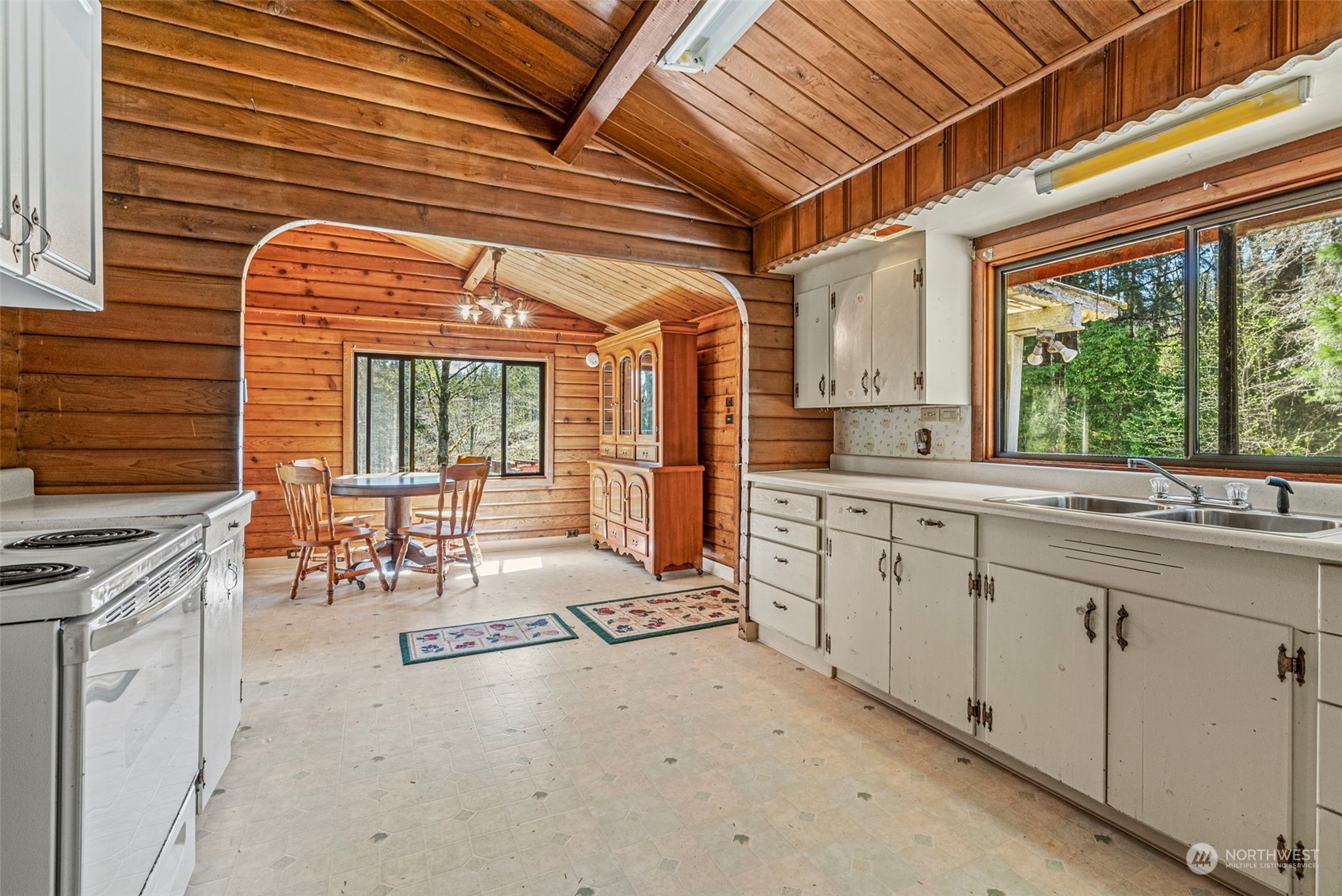 273 Middle Valley Road Skamokawa, WA 98647 - Photo 17 of 30 a open kitchen with stainless steel appliances granite countertop a stove a sink and cabinets