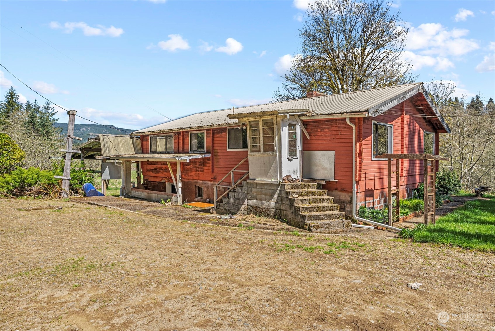 273 Middle Valley Road Skamokawa, WA 98647 - Photo 2 of 30 a view of a house with a yard and garage