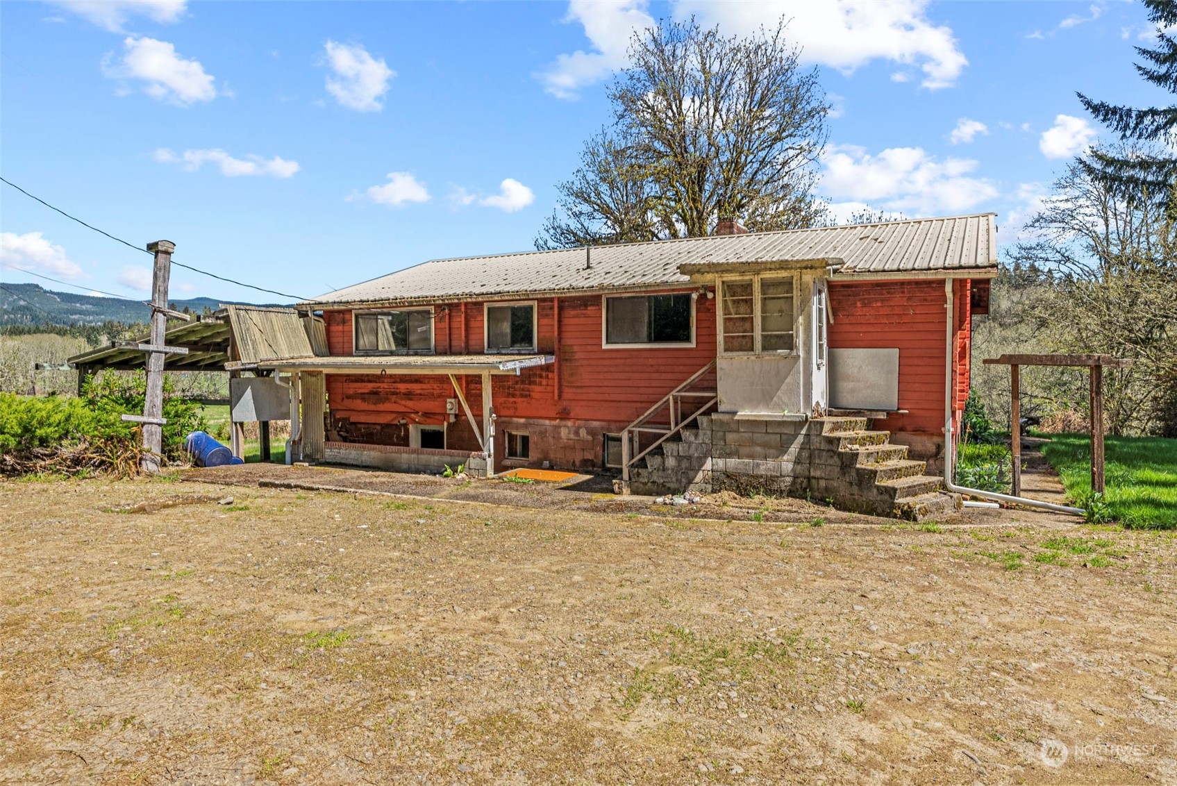 273 Middle Valley Road Skamokawa, WA 98647 - Photo 3 of 30 a view of a house with backyard porch and sitting area