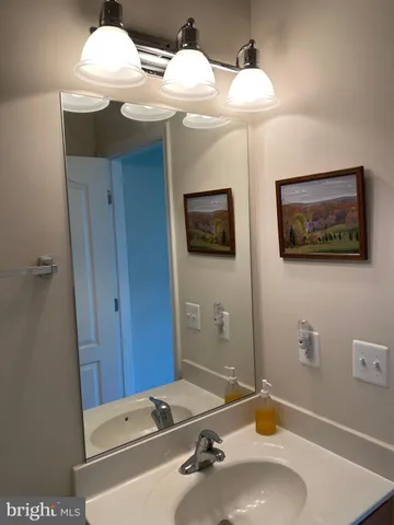 a view of room with wooden floor and fireplace