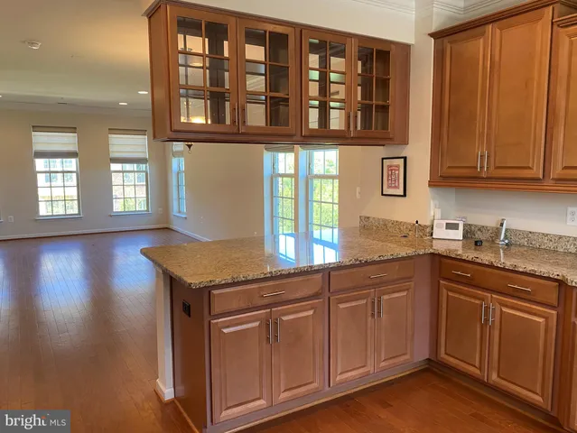 a kitchen with stainless steel appliances granite countertop a stove and a sink