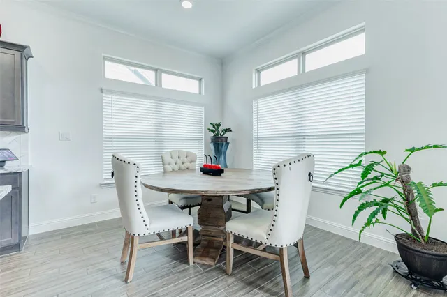 a view of a dining room with furniture and window