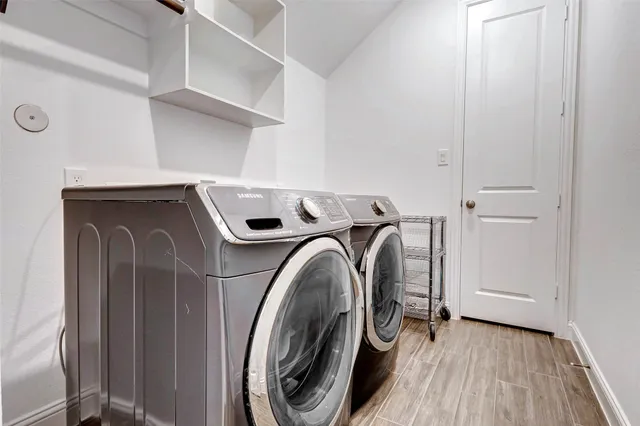 an outdoor sitting area with couch and umbrella