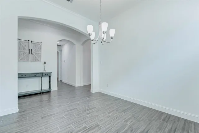 a view of a kitchen with stove and cabinets