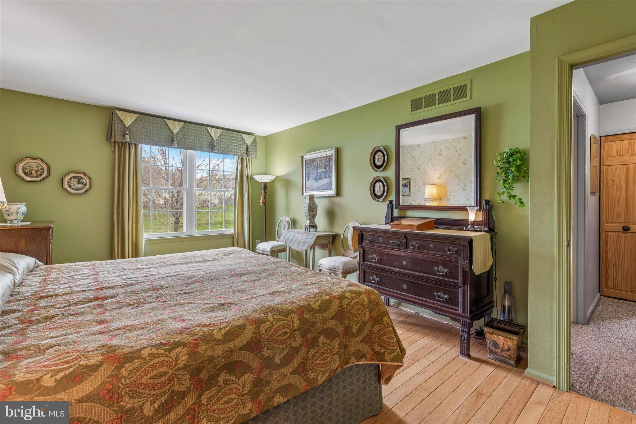 107 Carousel Circle Doylestown, PA 18901 - Photo 16 of 31 a bedroom with a bed and wooden floor