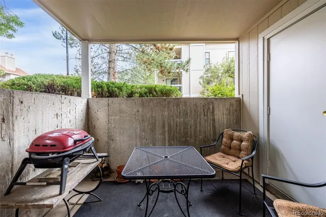 a view of a room with furniture and a window