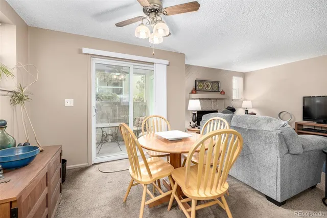 a dining room with furniture and window