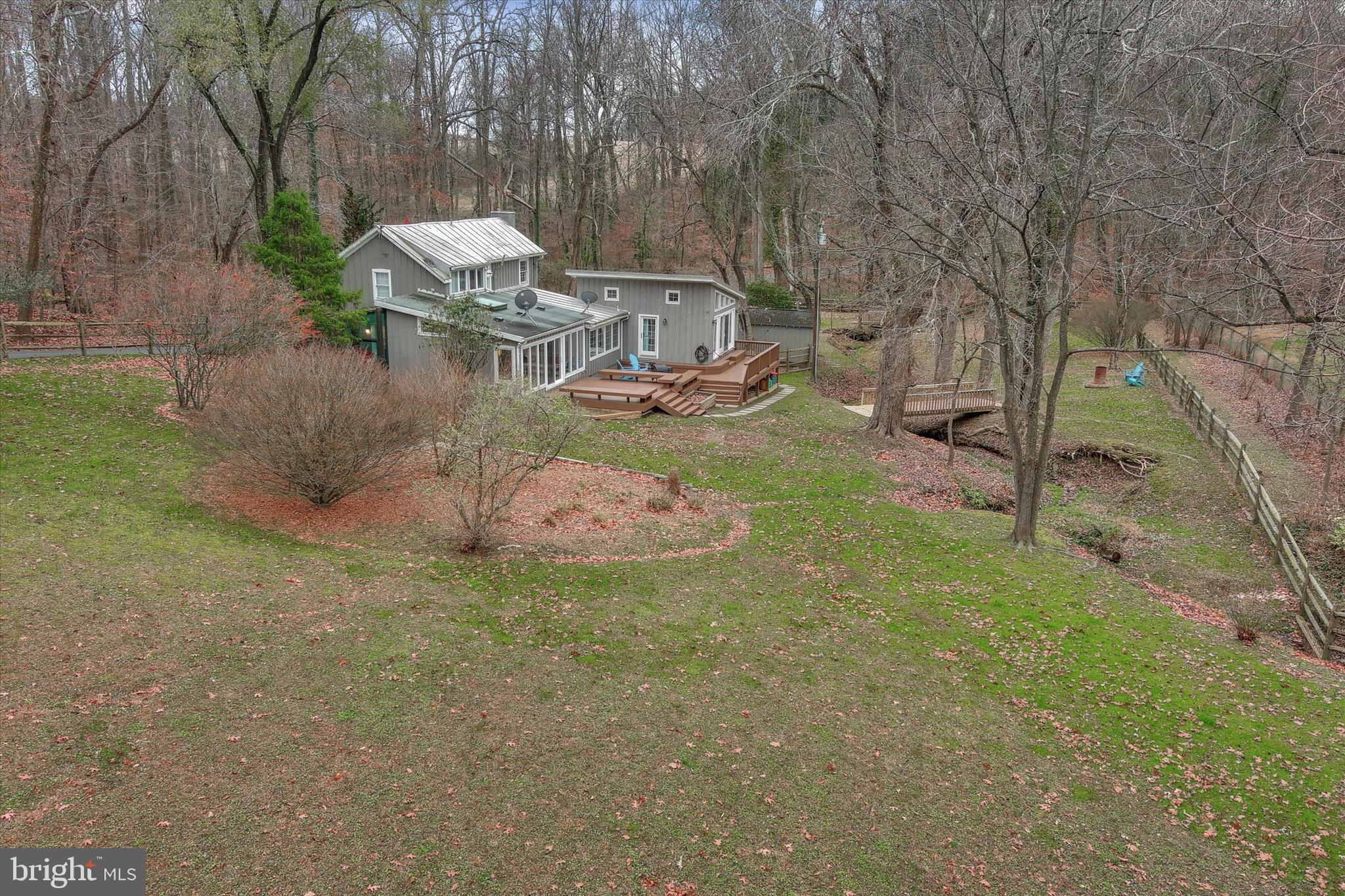 2404 Geist Road Glyndon, MD 21136 - Photo 47 of 63 a backyard of a house with table and chairs