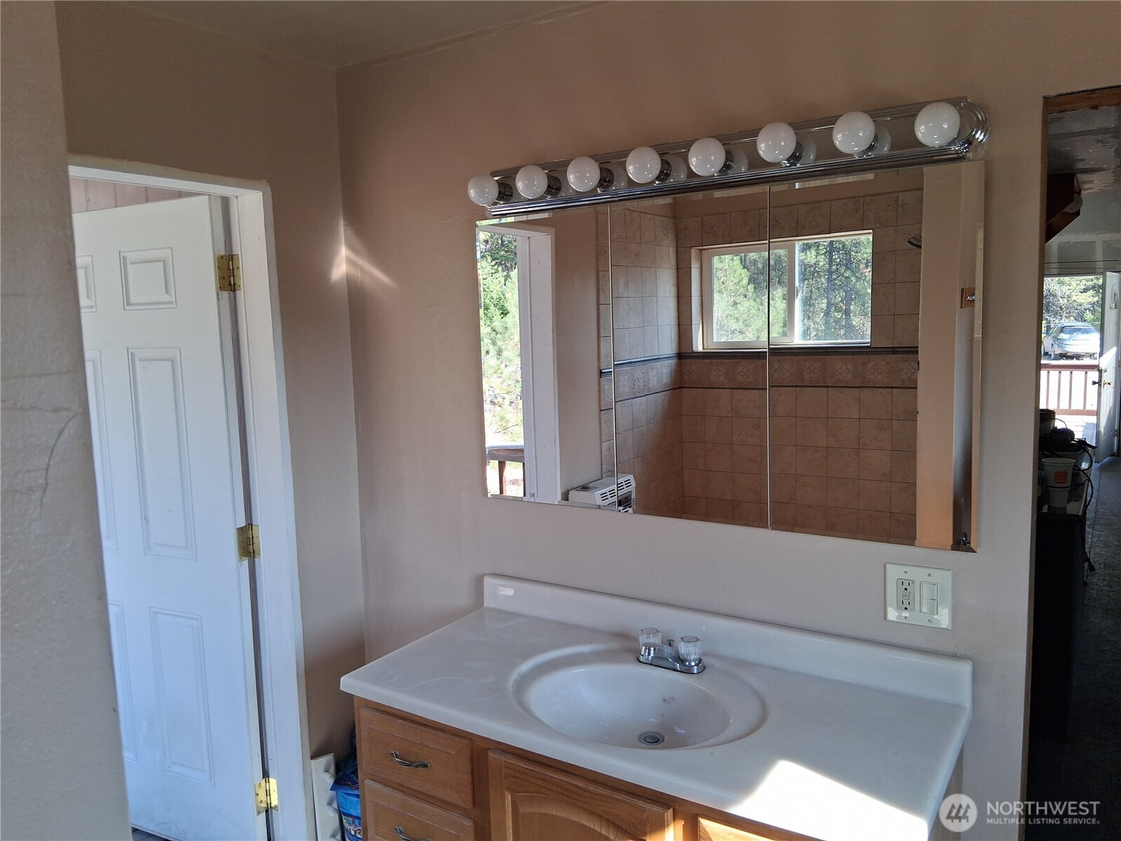 100 Turner Lake Road North Tonasket, WA 98855 - Photo 11 of 39 a bathroom with a sink vanity and a mirror