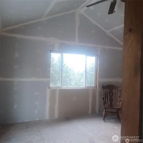 a view of a glass door and a window