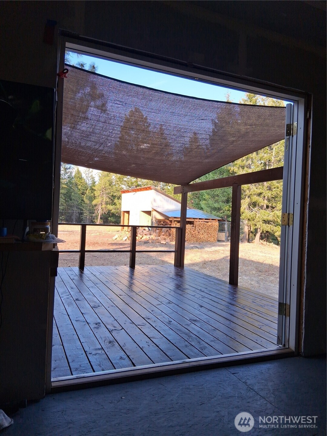 100 Turner Lake Road North Tonasket, WA 98855 - Photo 20 of 39 a view of an empty room with wooden floor and a window