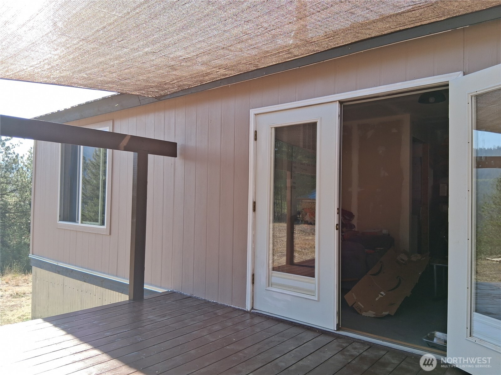100 Turner Lake Road North Tonasket, WA 98855 - Photo 21 of 39 a view of a hallway with wooden floor and entryway